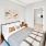 a bedroom with a bed and lamps