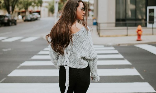 Settle into comfort at The Fynn a woman standing in a crosswalk