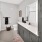 a bathroom with a mirror and a sink