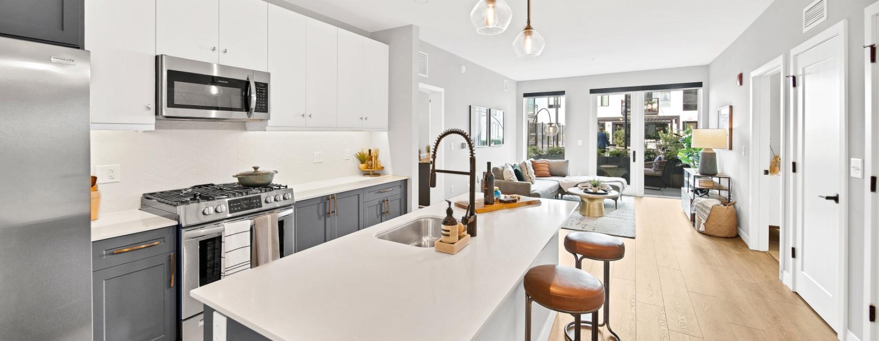 a kitchen with white cabinets