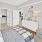 a bedroom with a bed and a mirror