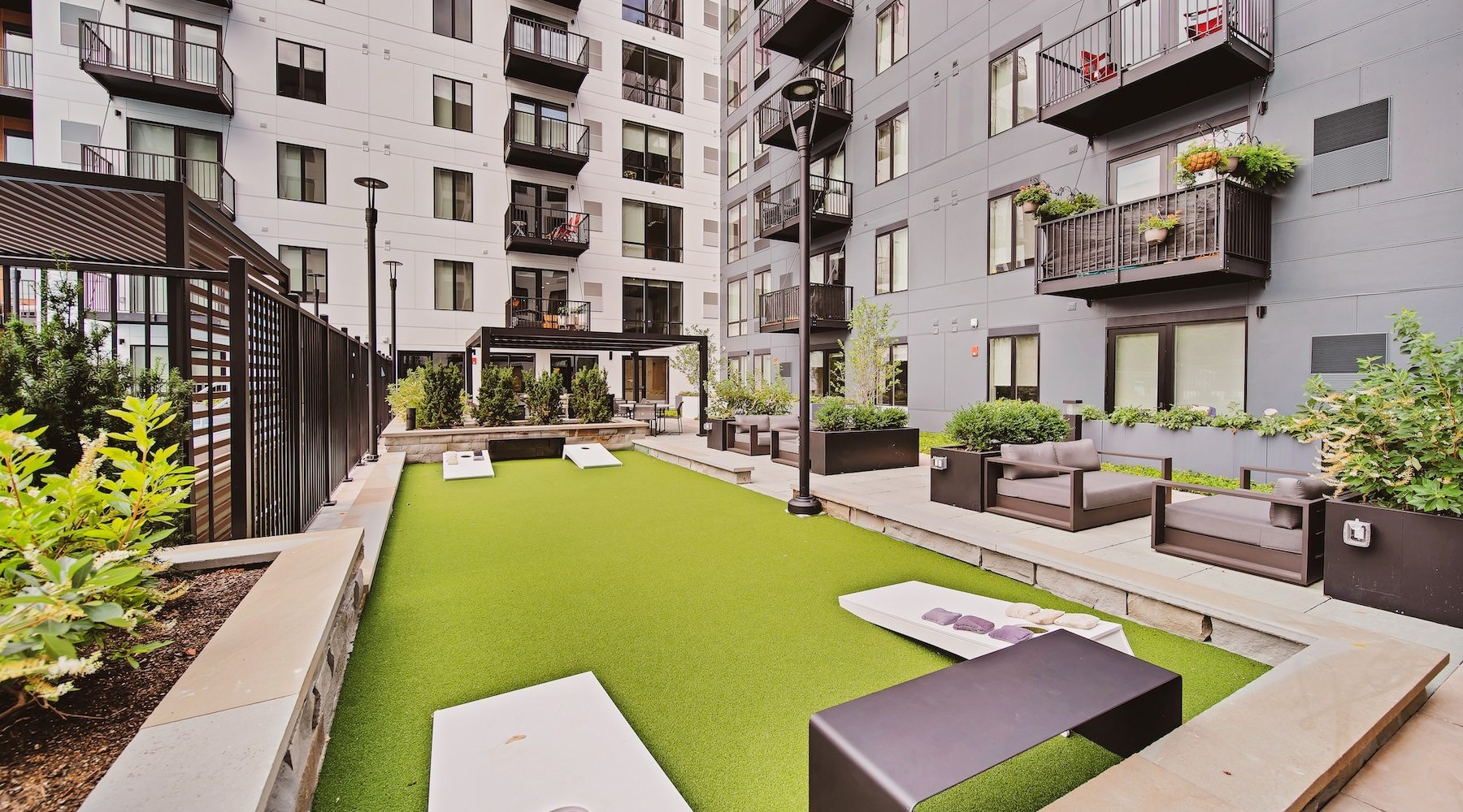 a courtyard with a pool and buildings