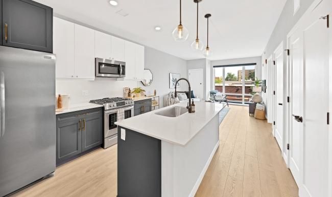 a kitchen with white cabinets