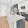 a kitchen with white cabinets