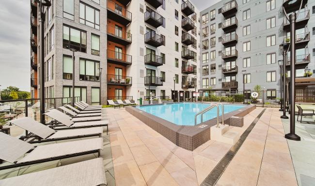 a pool in a courtyard between buildings