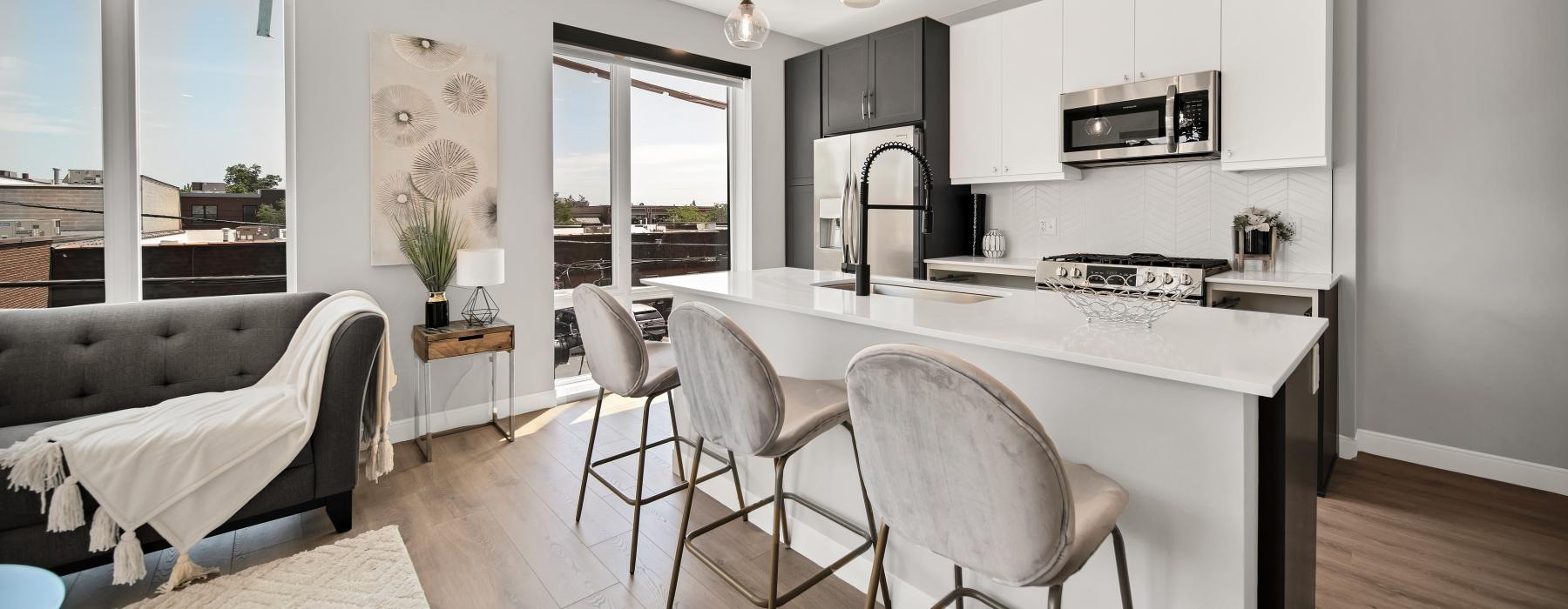 a kitchen with a table and chairs