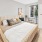 a bedroom with a bed and a table